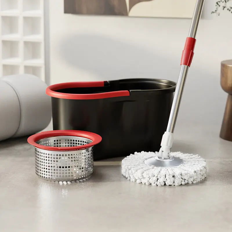 Cleaning set with black bucket, red accents, and white microfiber mop on a light-colored floor.
